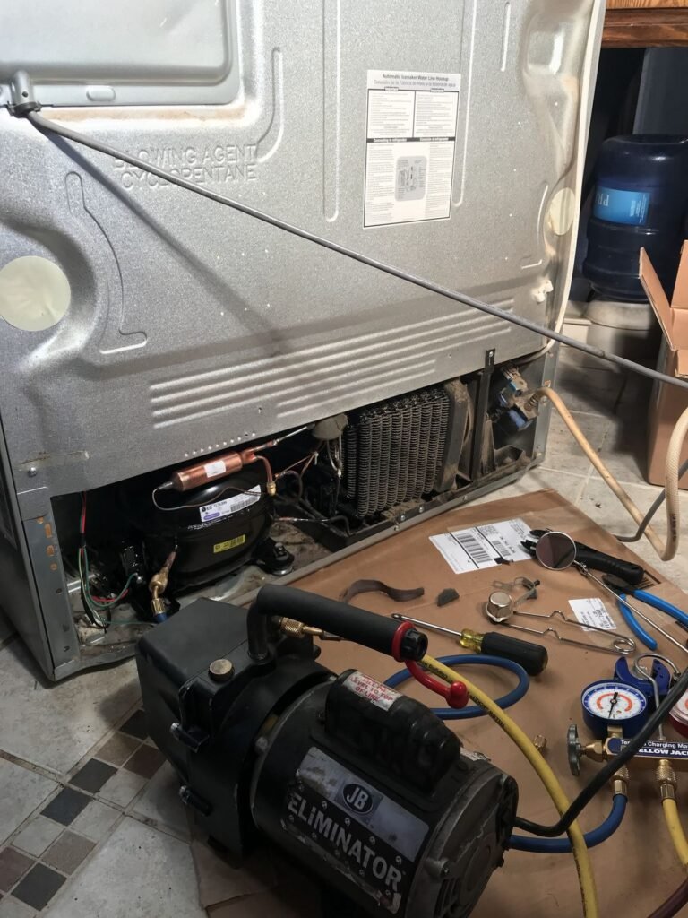 Fridge repair by JJ Smart Services technician