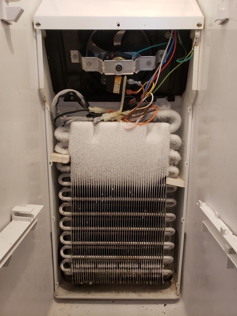 Fridge repair by JJ Smart Services technician