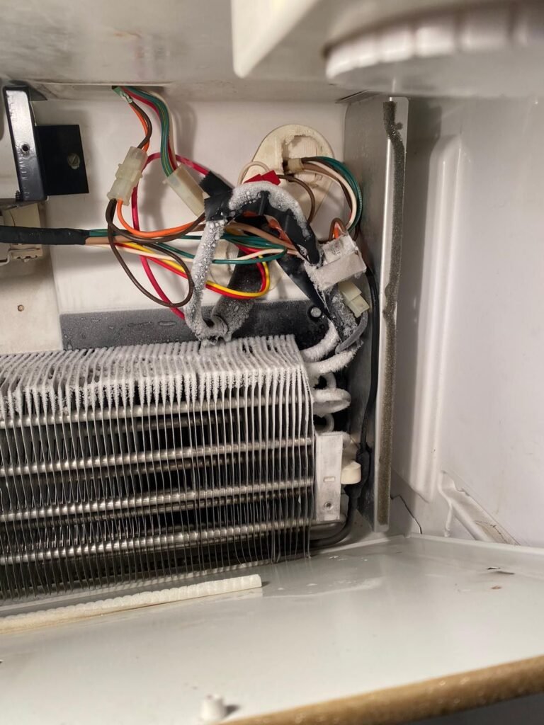 Fridge repair by JJ Smart Services technician